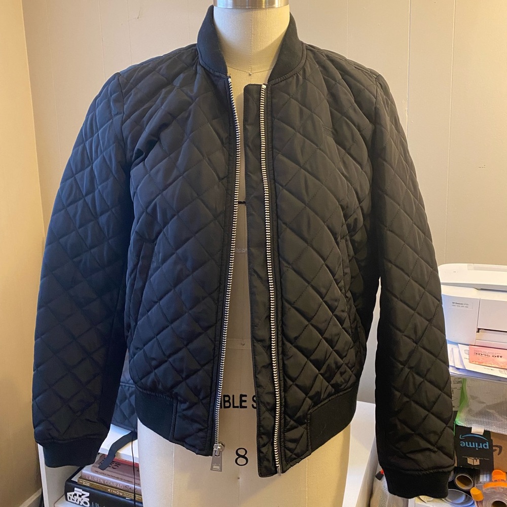 Women’s, black Levi’s quilted bomber jacket. Size small.
